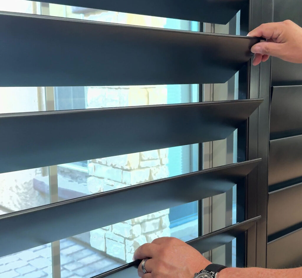 closeup of hands adjusting shutters